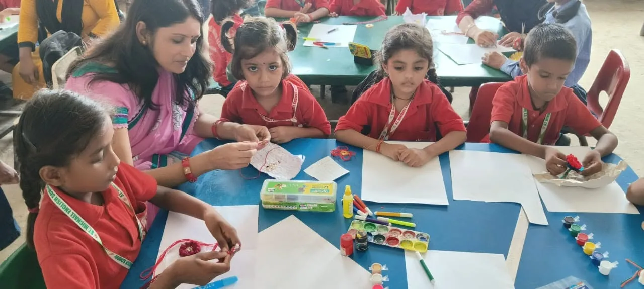 Younger students working on a craft activity at their desks in a classroom