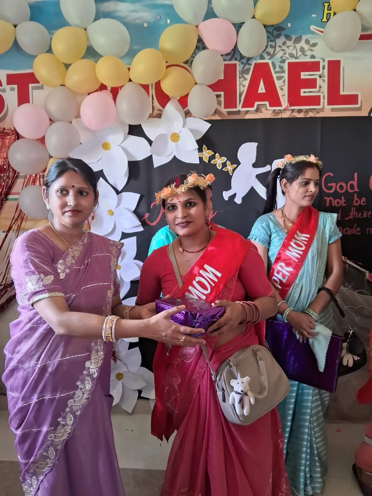 Parents being welcomed at a Mother’s Day celebration held at the school