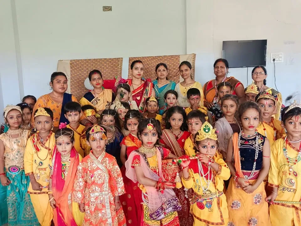 Young students in colourful costumes lined up together for a fancy dress event