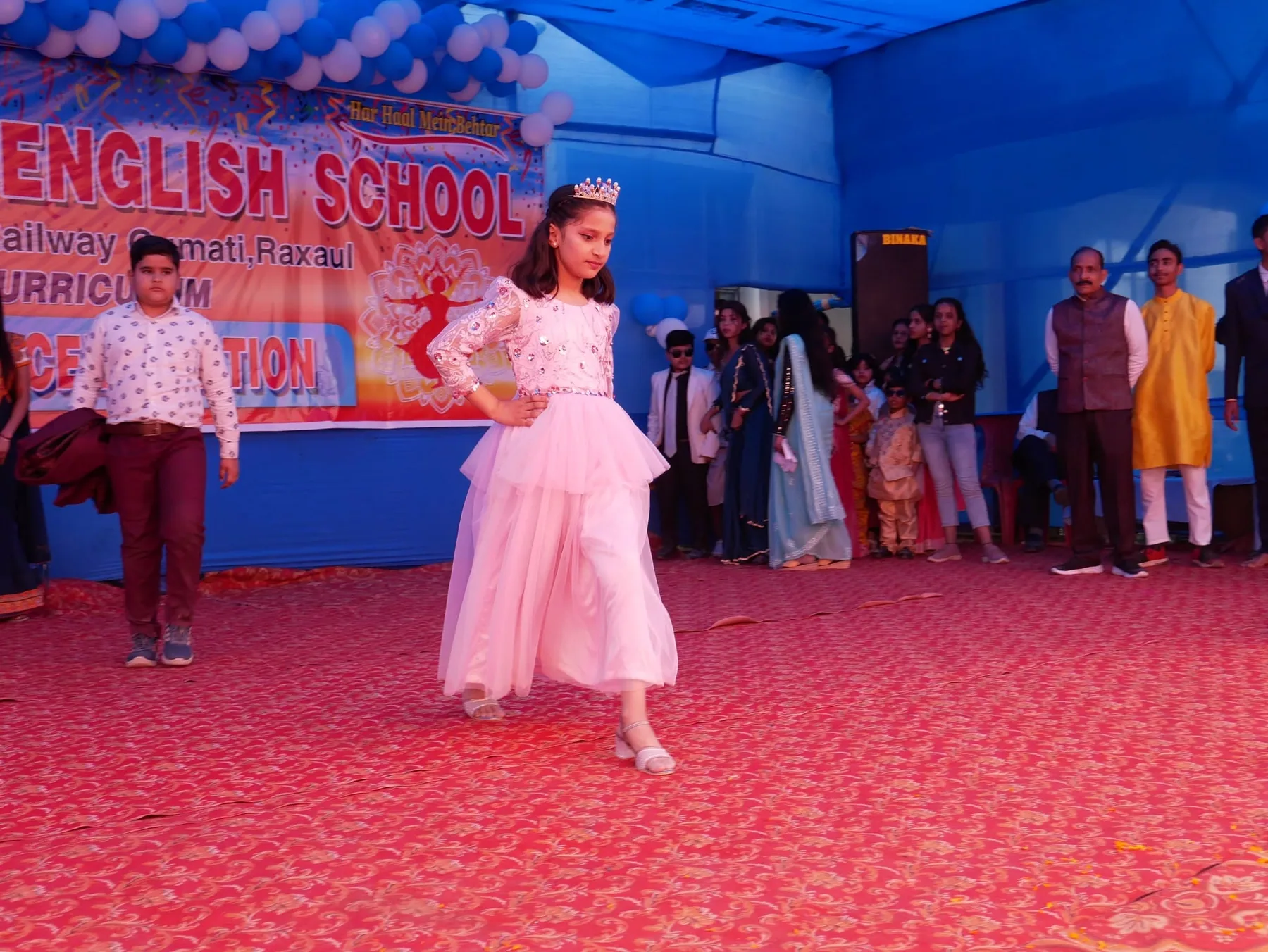 A student performing on stage during the annual day celebration